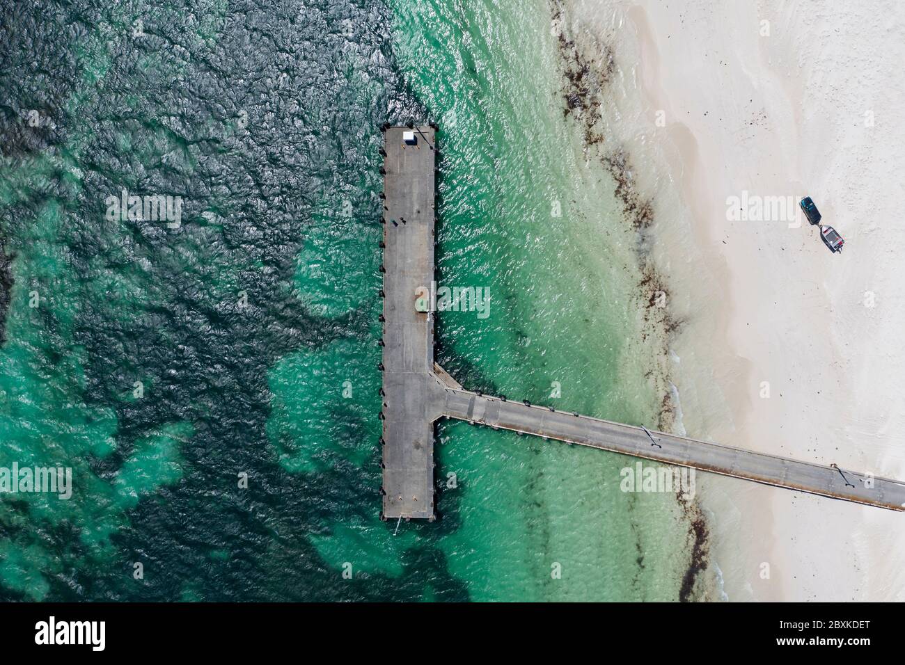 Aerial overhead view of the jetty at Lancelin in Western Australia; a car pulling a boat prepares to launch into the ocean Stock Photo