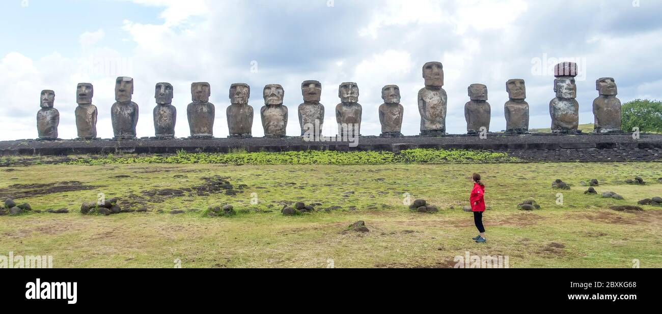 Woman looks at moai at Ahu Tangariki, Easter Island, Chile Stock Photo