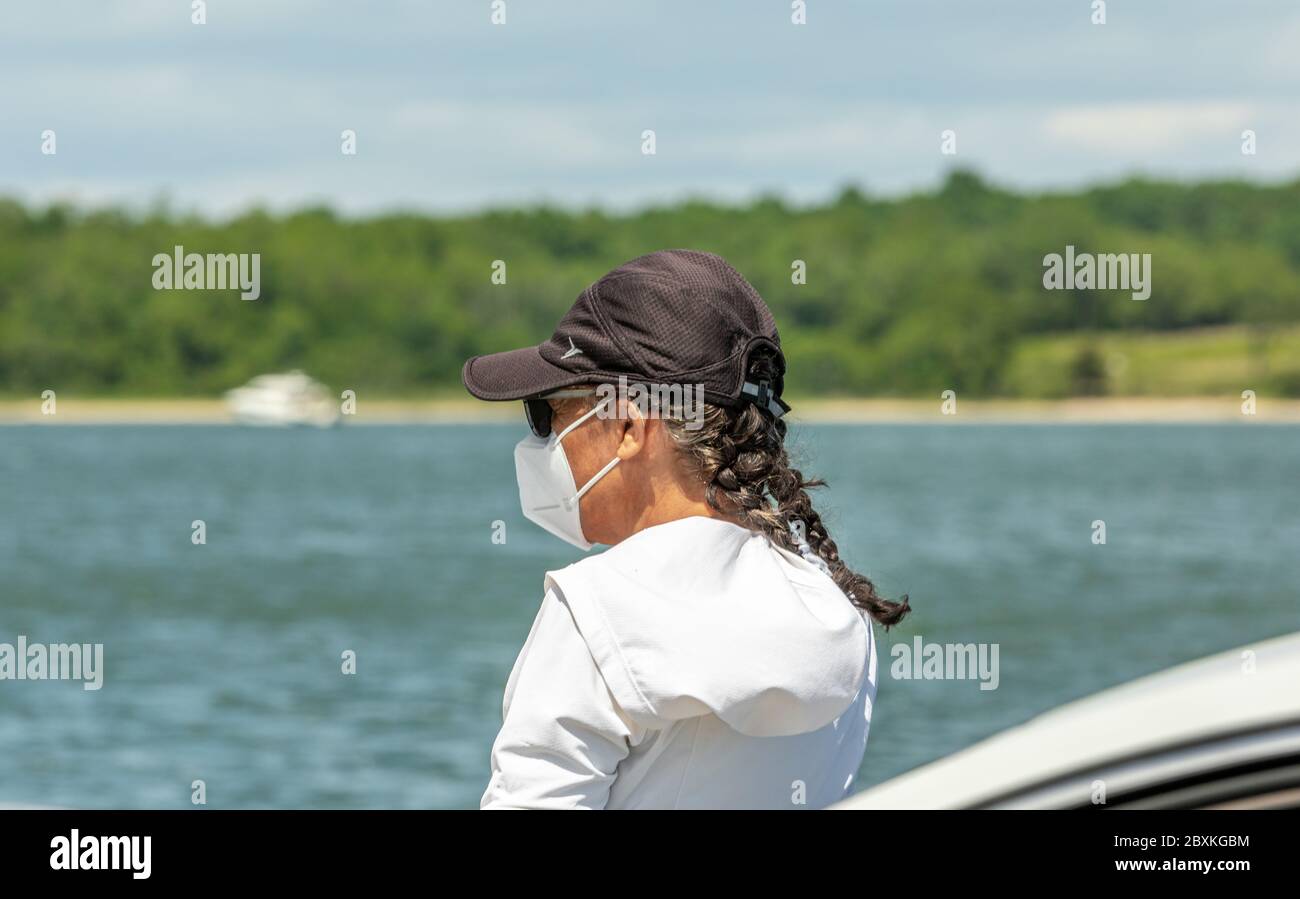 A woman on the Shelter Island Ferry during Covid-19 wearing a mask, Shelter Island, NY Stock Photo