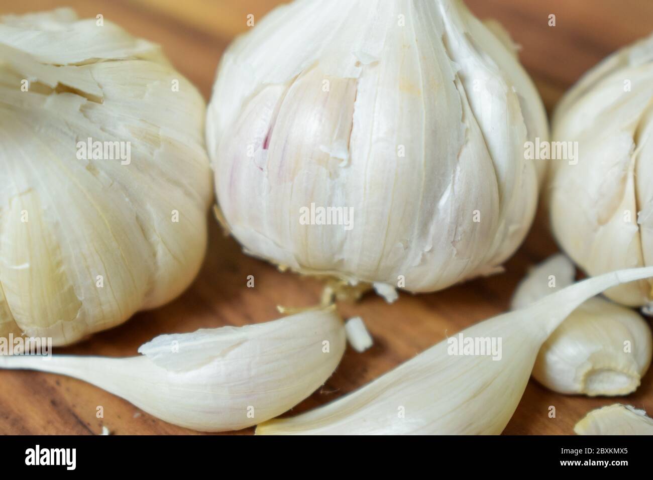 Garlic and Garlic Cloves on a Vintage Wooden Background Stock Photo - Alamy