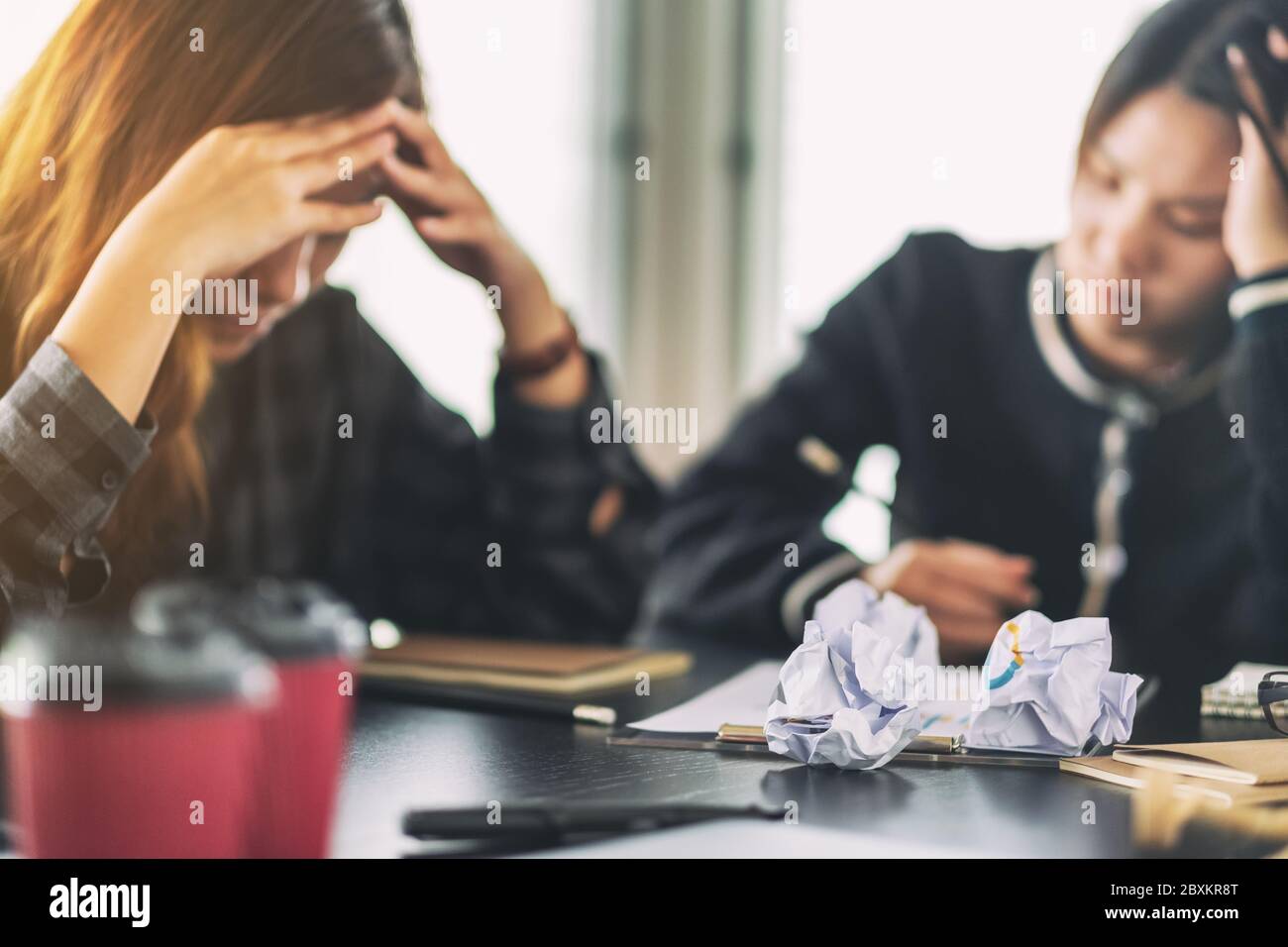 Businesspeople get stressed while having a problem in business meeting Stock Photo