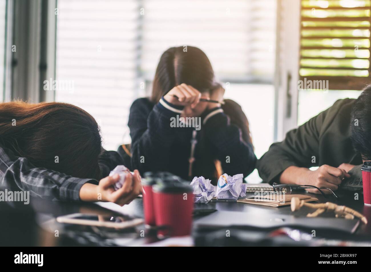 Businesspeople get stressed while having a problem in business meeting Stock Photo