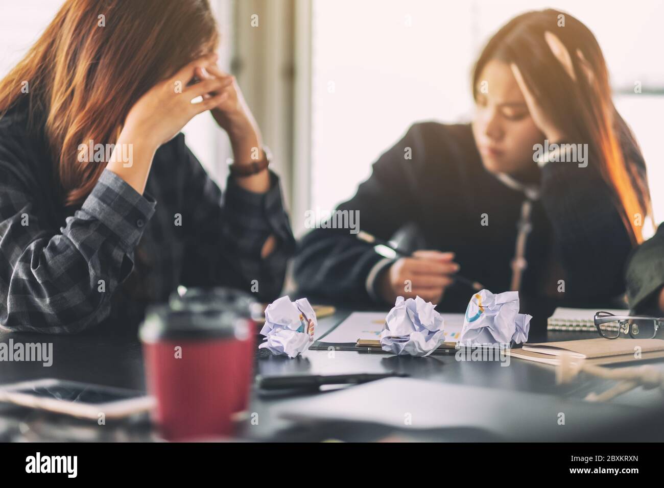 Businesspeople get stressed while having a problem in business meeting Stock Photo