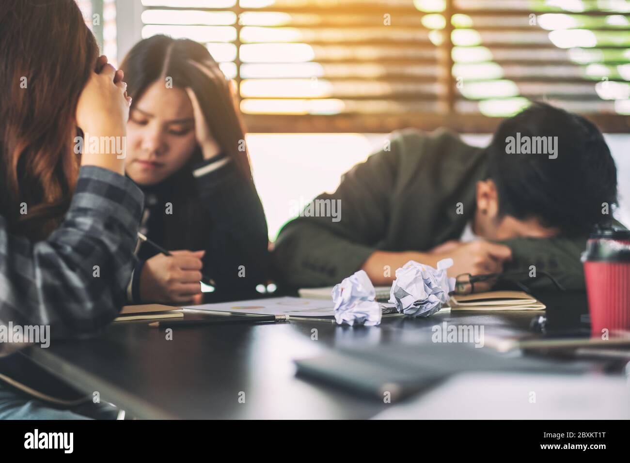 Businesspeople get stressed while having a problem in business meeting Stock Photo