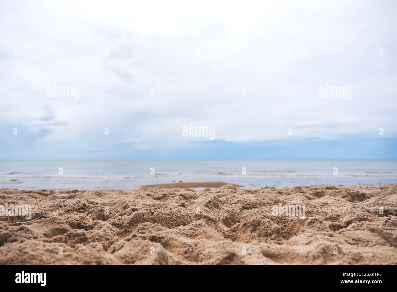 Landscape image of sand on tropical beach with blue sky background ...