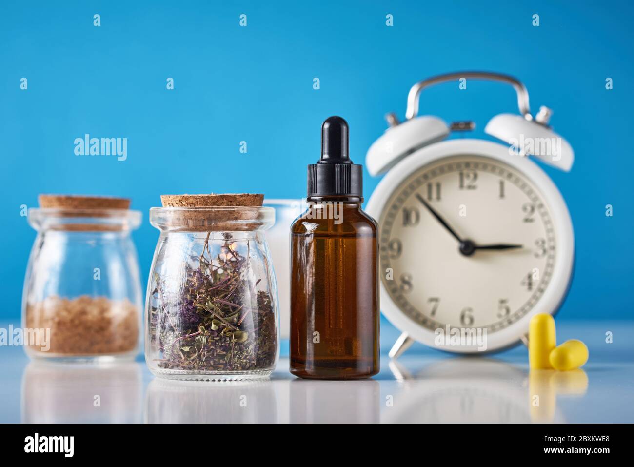 Herbal medicine for treat depression and insomnia concept. Alarm clock