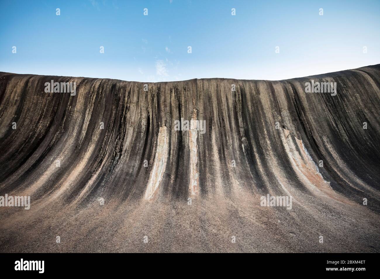 Wave Rock, a 15 metre high natural rock formation that is shaped like a tall breaking ocean wave and is located at Hyden in Western Australia Stock Photo