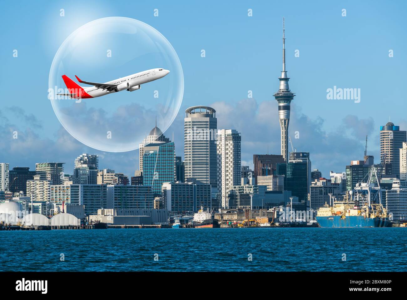 Travel bubble concept - Airplane traveling in bubble representing international travel bubble project to revive tourism and hotel industry among count Stock Photo