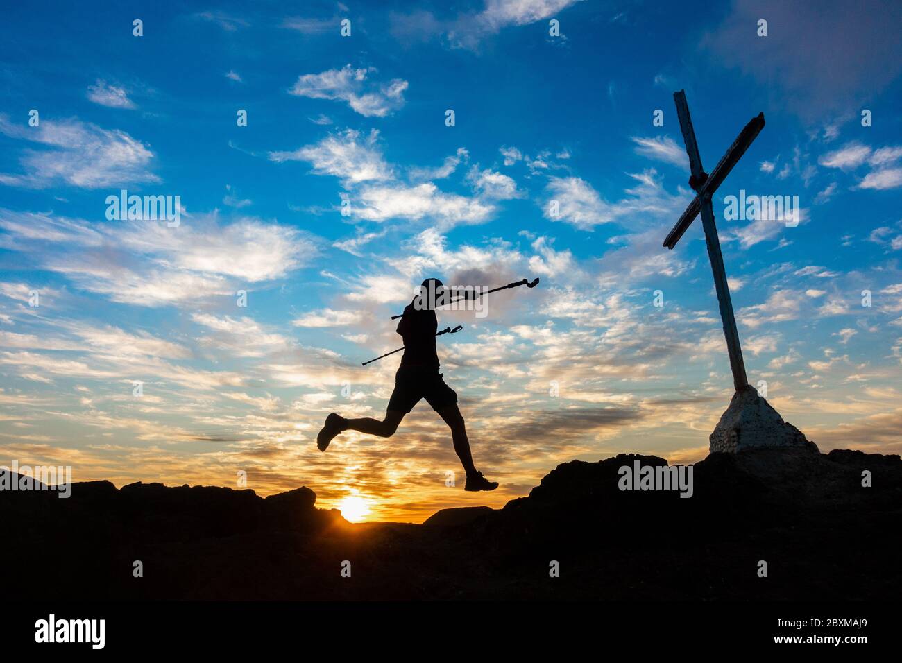 Trail runner on mountain summit at sunrise Stock Photo - Alamy