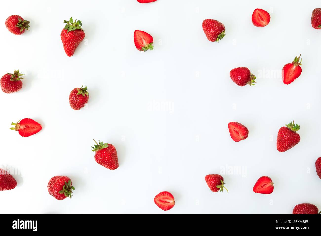 Strawberry frame on white background. Flat lay. Top view. Sweet berries