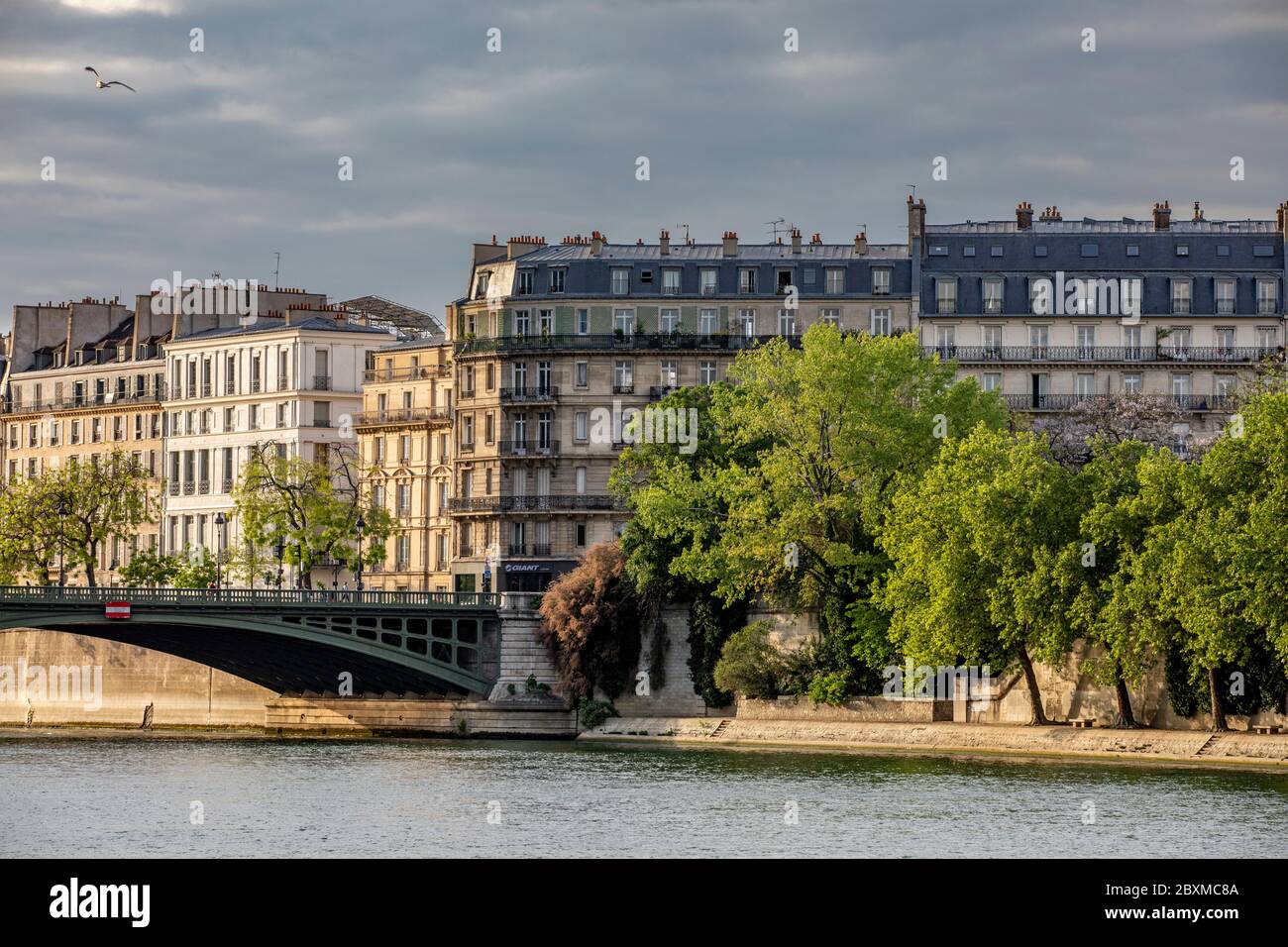 Paris, France - April 25, 2020: Typical Haussmann buildings along the Seine river Stock Photo