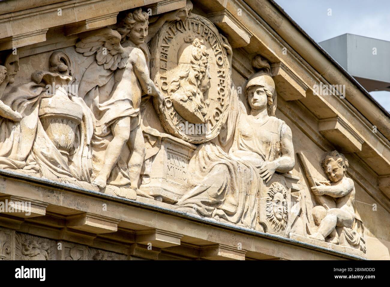Paris, France - May 1, 2020: Private house with statue on the pediment in Paris Stock Photo