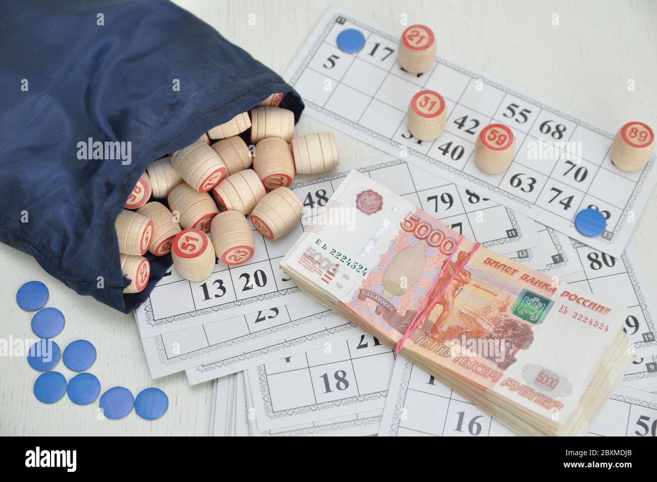 Russian rubles. board game lotto. Wooden barrels on paper cards, a game for money. Stock Photo