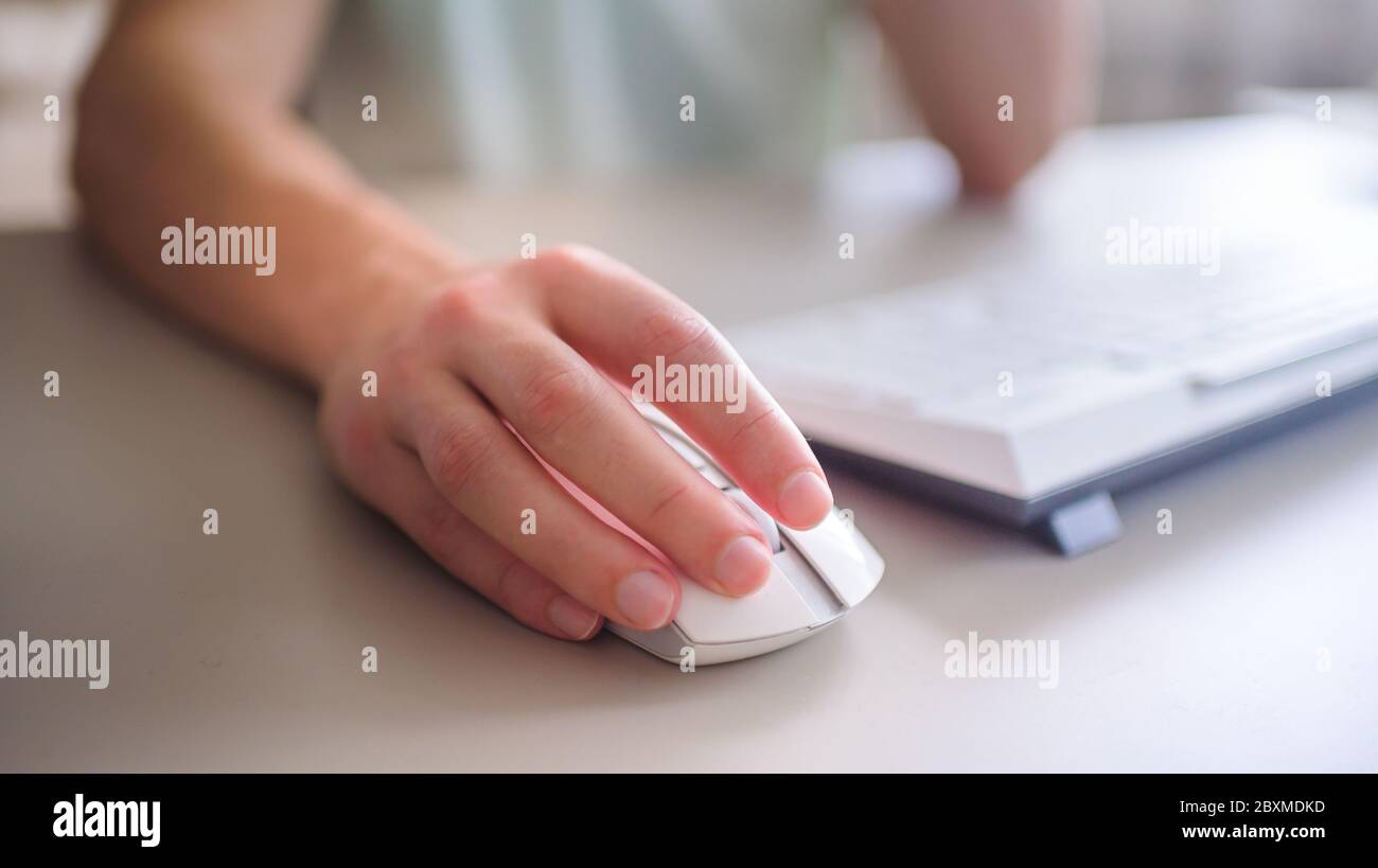the developer works at the computer, uses mouse Stock Photo Alamy