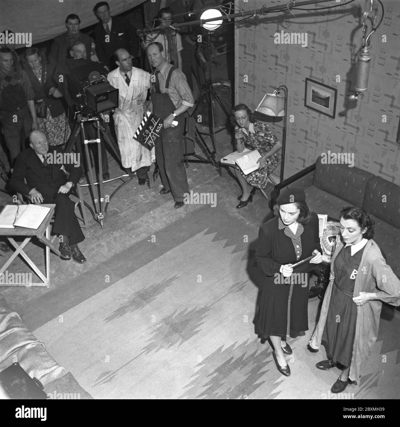 Viveca Lindfors. Swedish actor. 1920-1995. Pictured here during filming in Sweden 1943. The scene in the filmstudio is ready for filming. The director, cameraman and the filmcrew are ready. Stock Photo