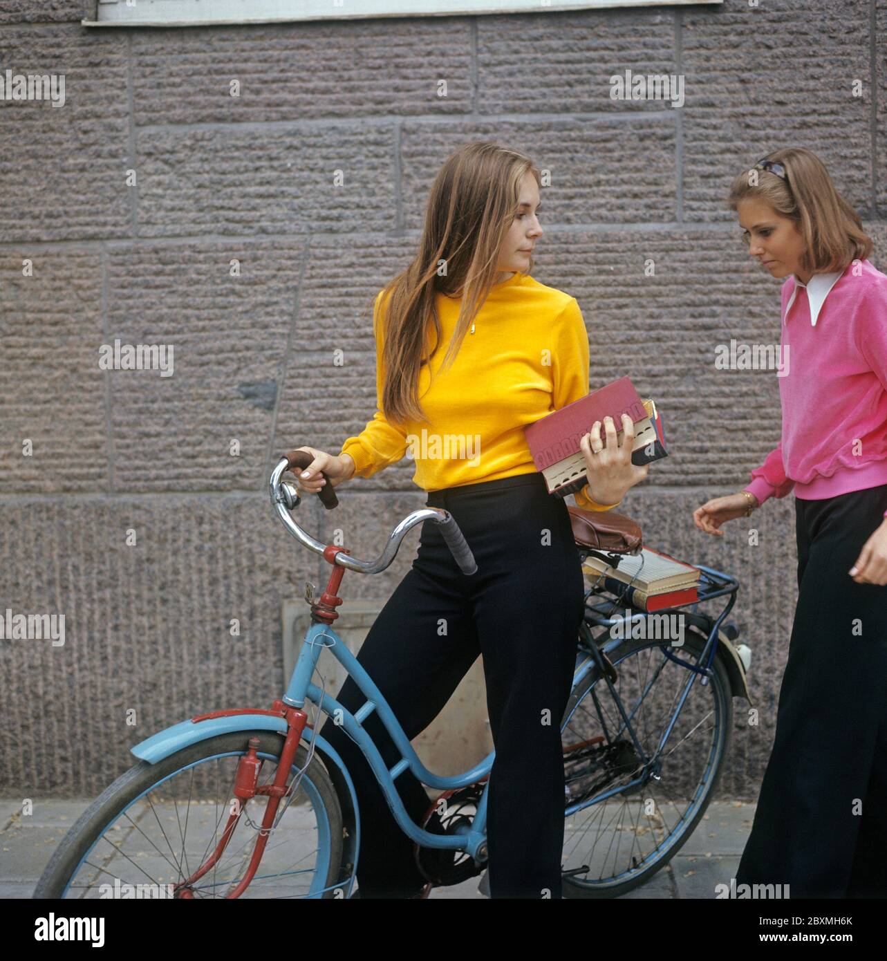 The Girl In The Yellow Jumper In the 1970s. Two young women dressed in typical 1970s fashion and