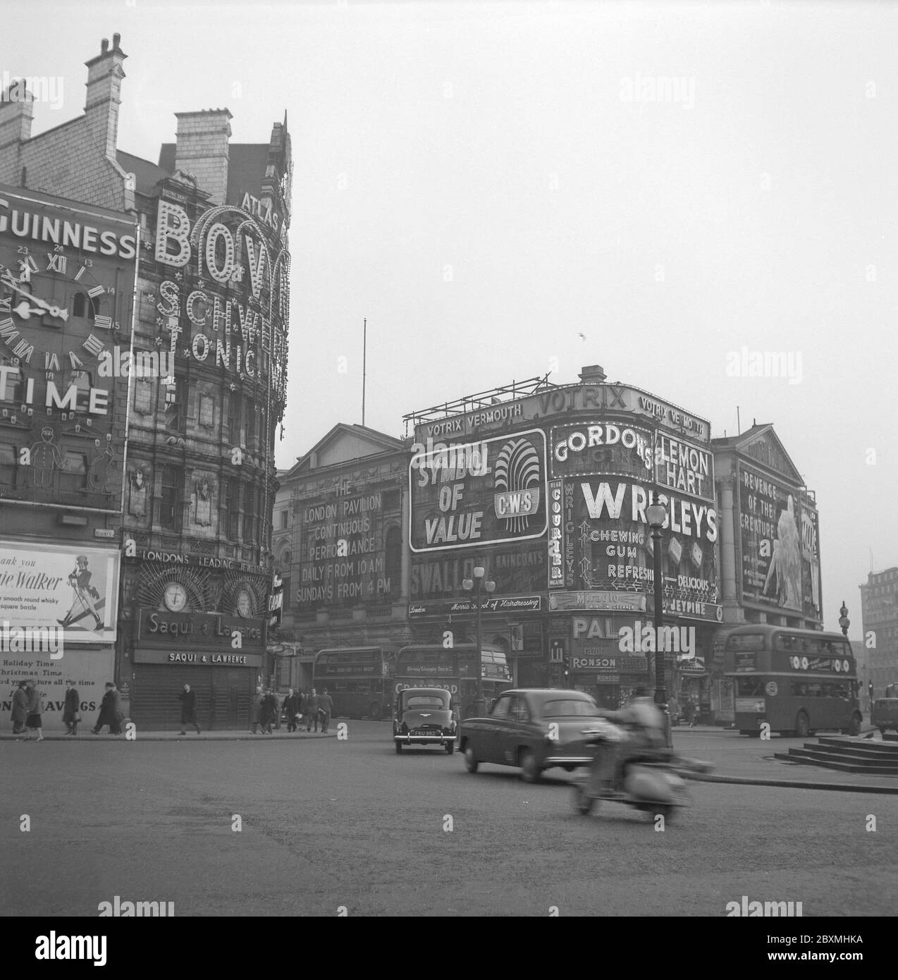 London in the 1950s. The traffic and the neon signs at the Piccadilly Circus i London 1952 Stock Photo