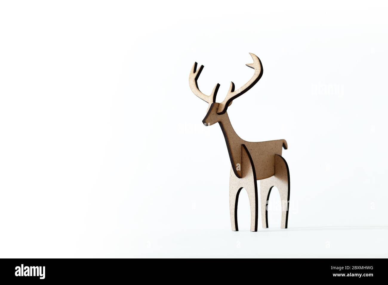 Single reindeer cardboard toy isolated on a white background. Christmas icon with Text space Stock Photo