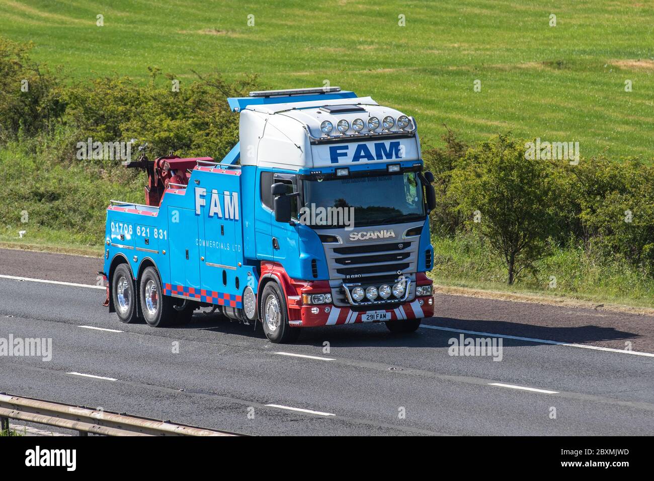 FAM Commercials Ltd; Haulage delivery trucks, lorry, transportation, truck, cargo carrier, Scania R620 vehicle, European commercial transport industry HGV, M6 at Manchester, UK Stock Photo