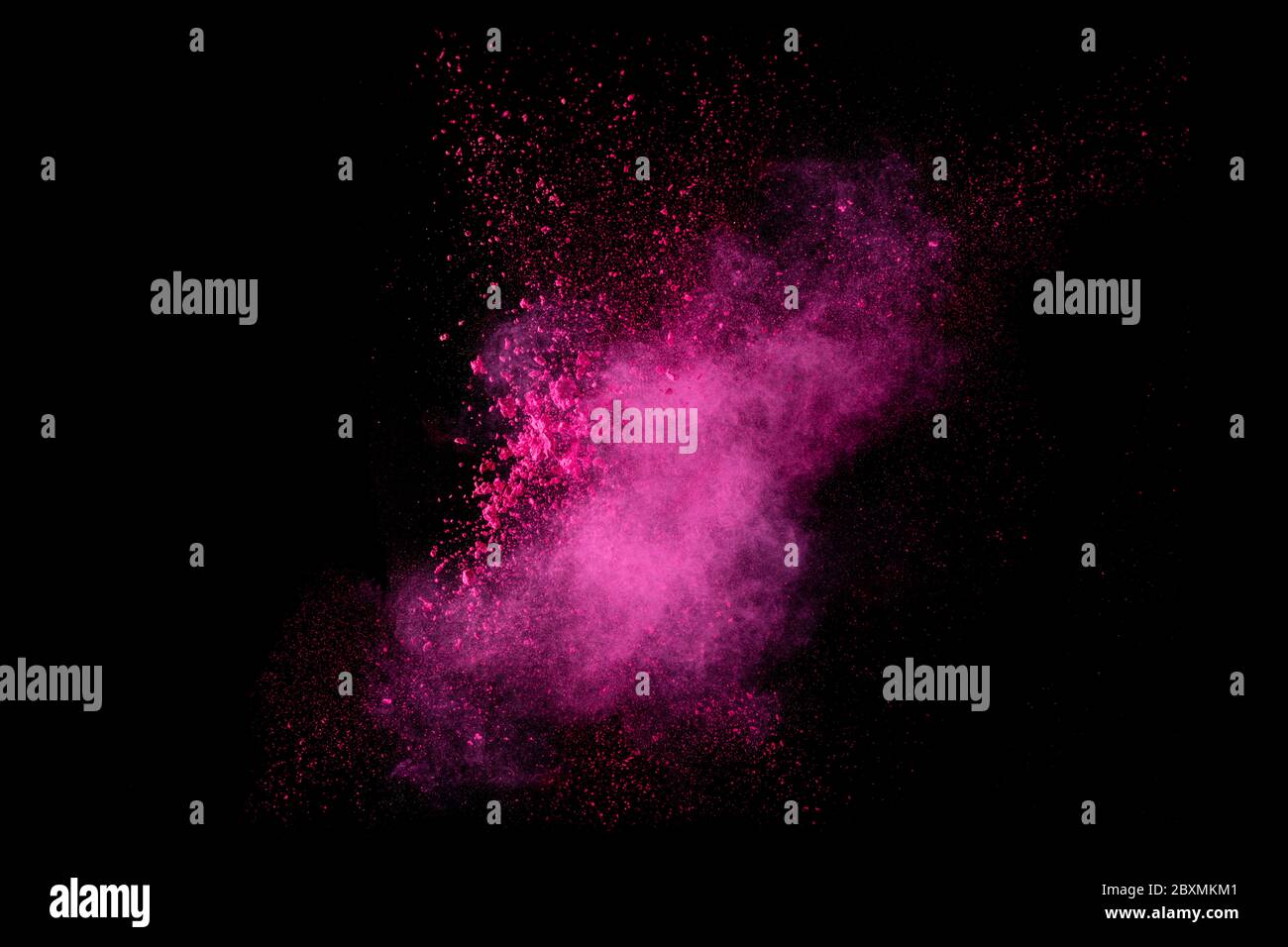 Closeup of a colorful dust particle explosion isolated on black. Abstract background. Color