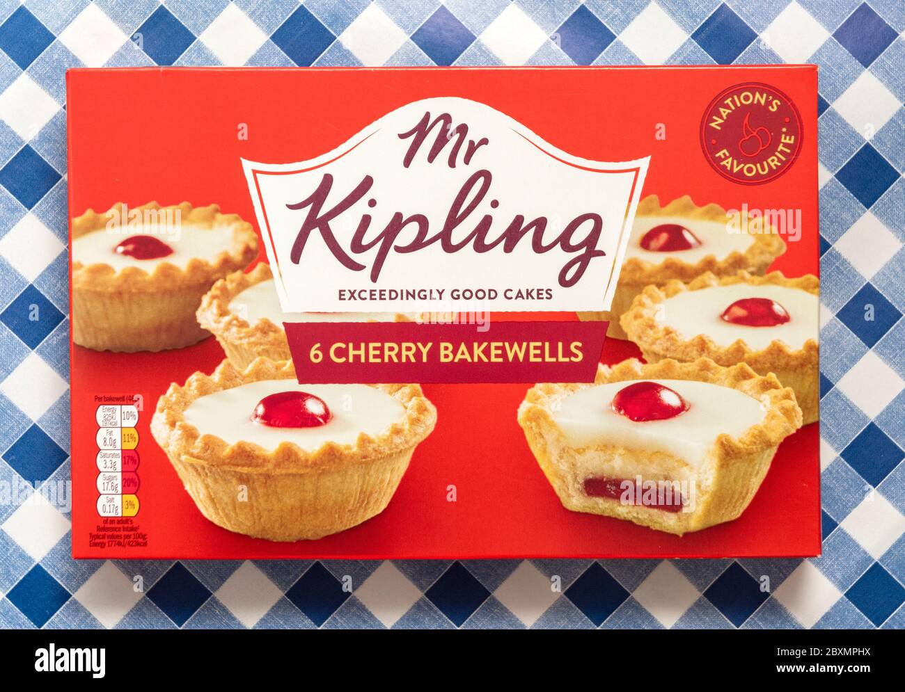 Mr Kipling 6 cherry bakewells on a blue gingham background Stock Photo