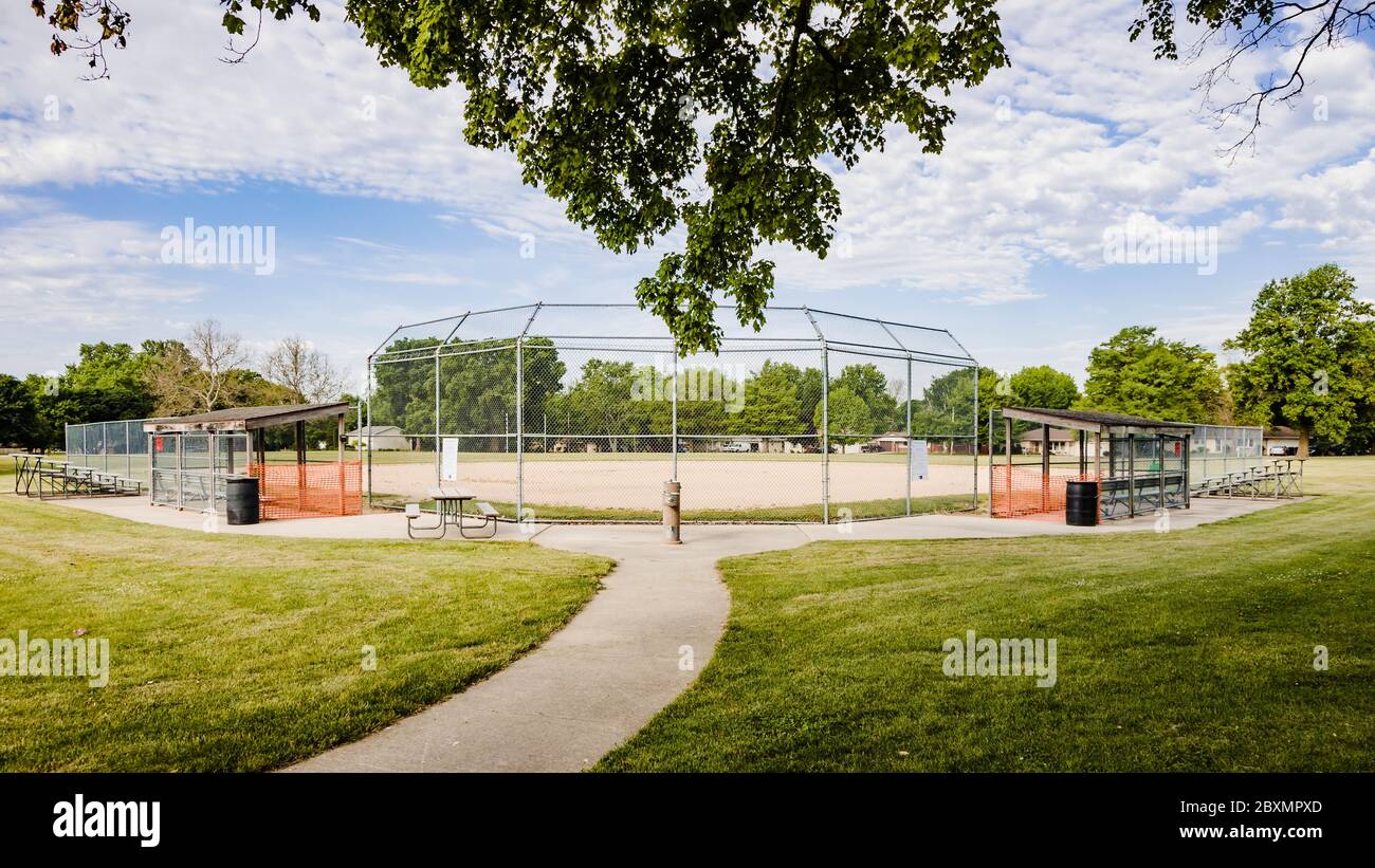 a view of a youth baseball field in a city park Stock Photo