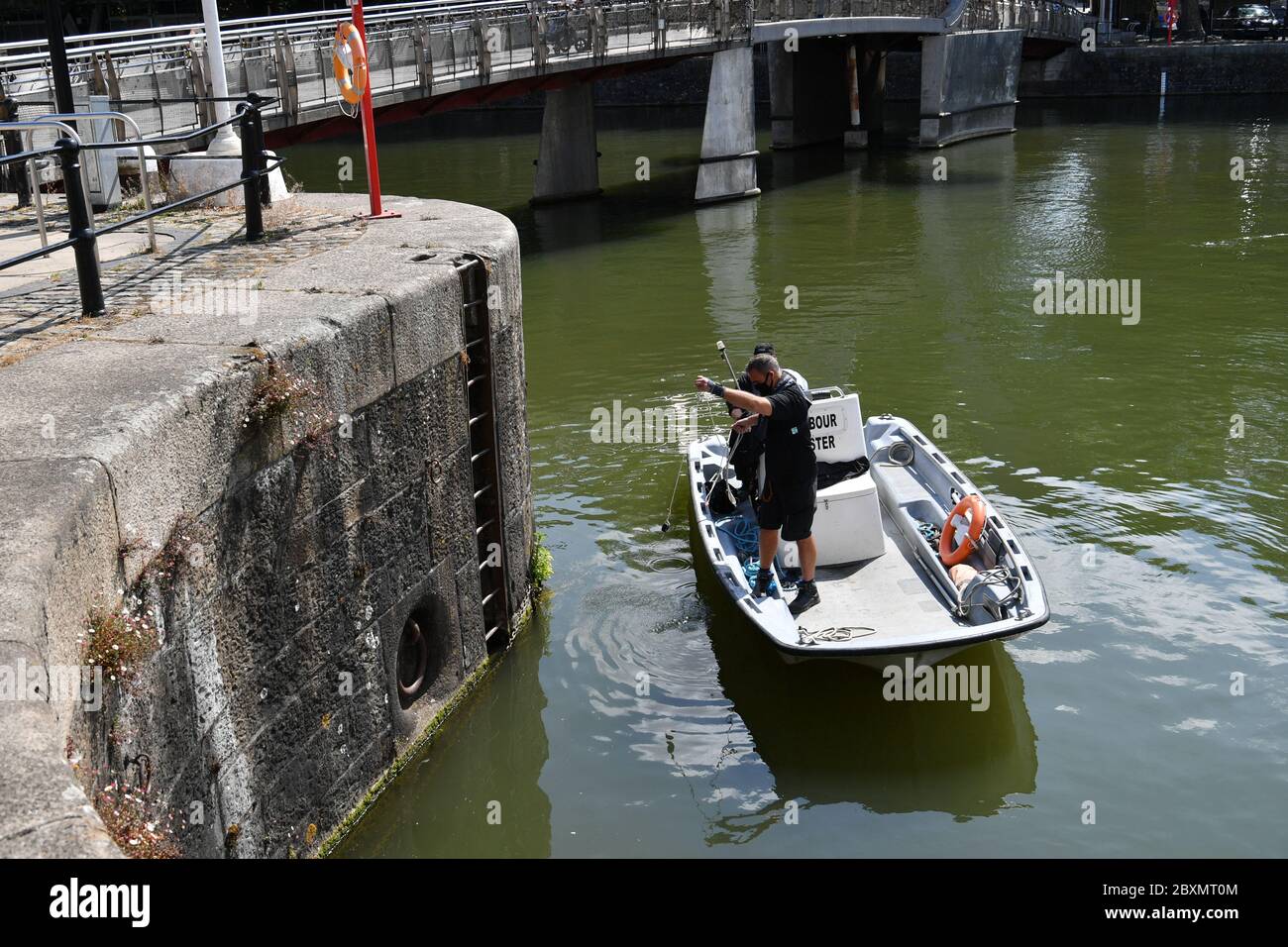 The Harbour Master checks the depth of the area of water where the statue of Edward Colston was dumped during a Black Lives Matter protest on Sunday to make sure its not a navigational hazard. The protests were sparked by the death of George Floyd, who was killed on May 25 while in police custody in the US city of Minneapolis. Stock Photo