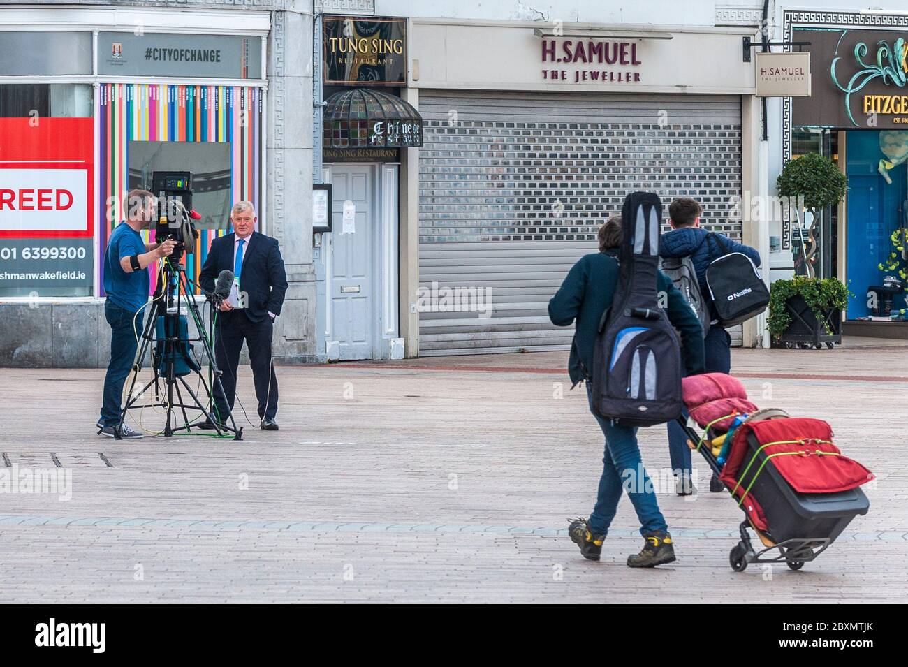 Cork, Ireland. 8th June, 2020. Many shops in Ireland are re-opening today after a 3 month closure due to the Covid-19 pandemic. Paul Byrne of Virgin Media News was reporting from Patrick Street, Cork, on the re-opening. Credit: AG News/Alamy Live News Stock Photo