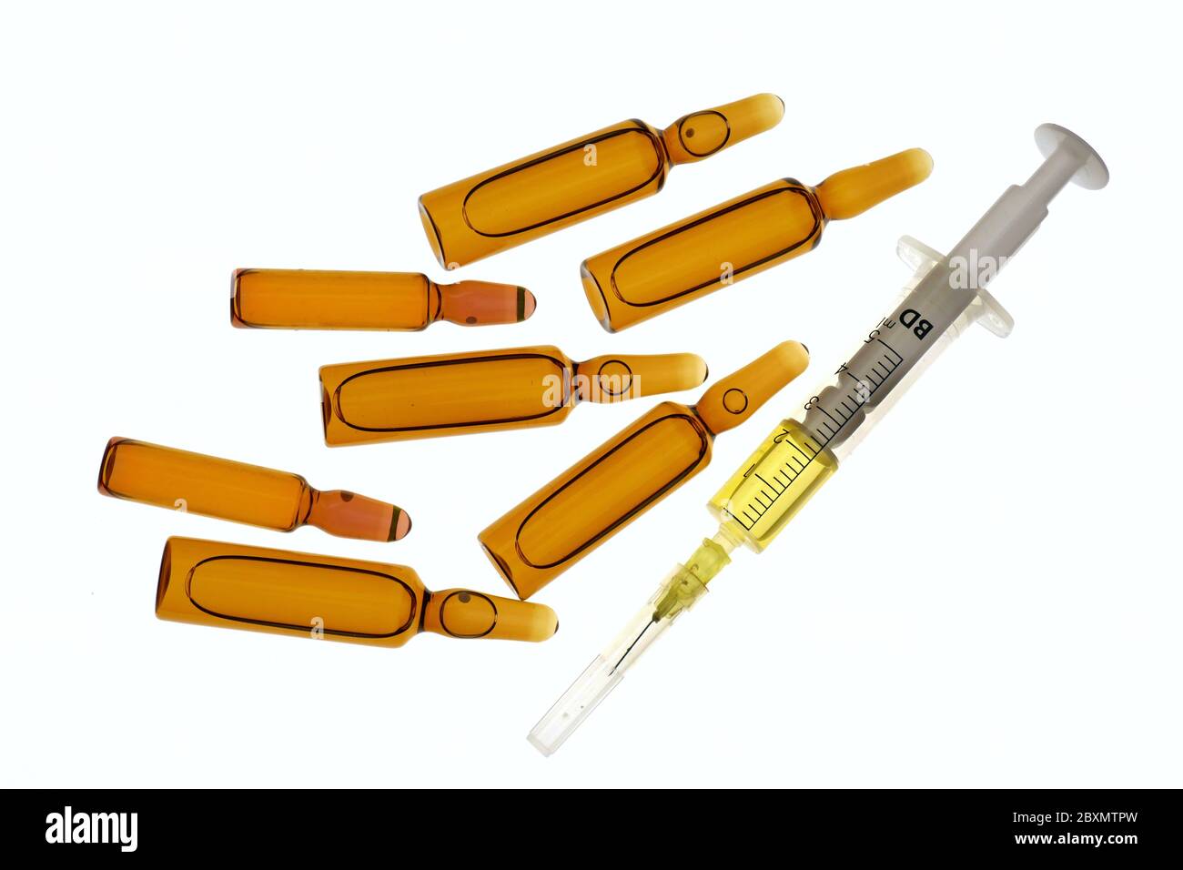 Medical ampoules and syringe Isolated on a white background.Medicine and health concept. Beauty industry concept.Vaccination for viral diseases. Brown Stock Photo