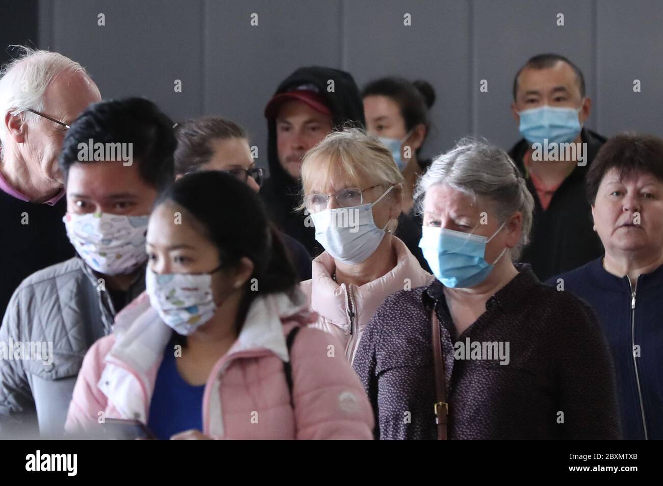 People wearing facemasks queueing outside Ikea in Dublin as the next