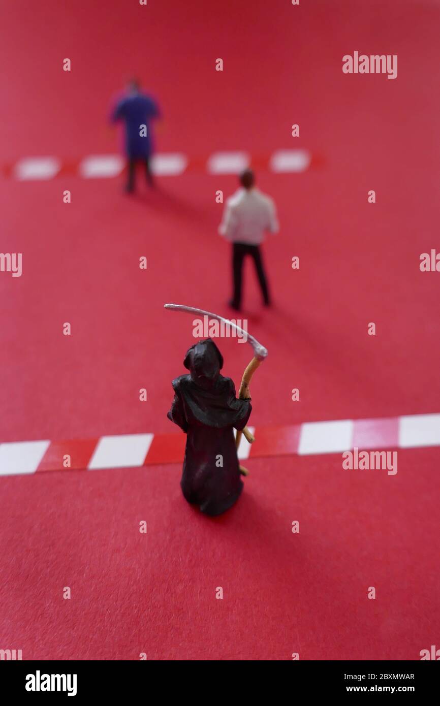 Social distance.Keep the distance concept.Coronavirus Safety Rules.Safe distance. People figures and death with separation lines on a bright red backg Stock Photo