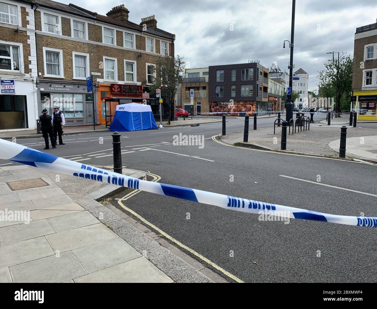 the-scene-at-askew-road-at-the-junction-with-ashchurch-terrace-as-a
