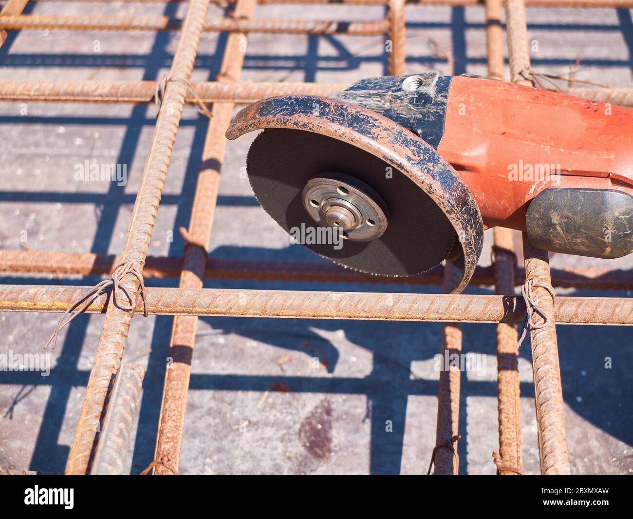 Angle grinder and reinforcement framework of concrete slab Stock Photo