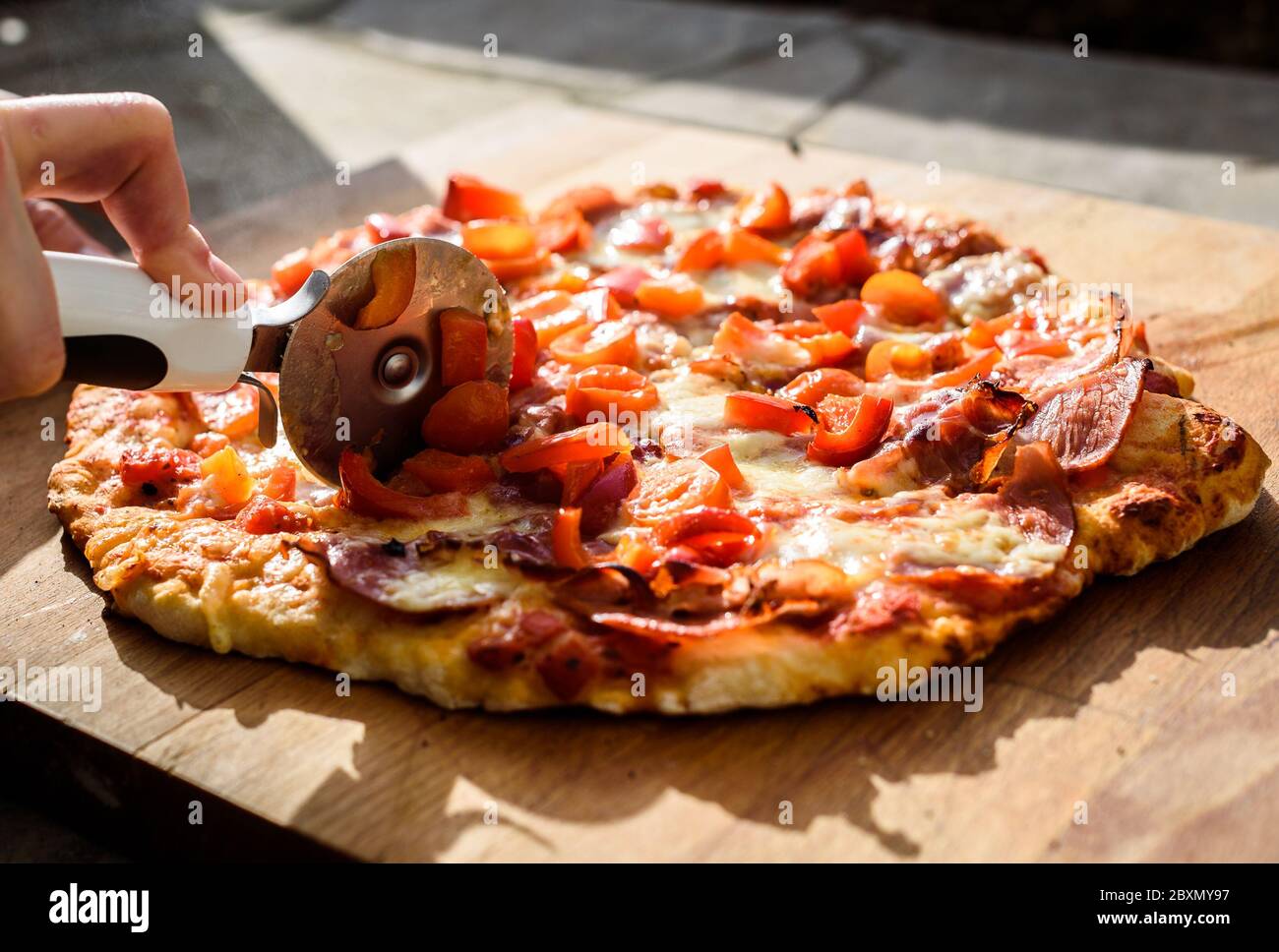 Making of homemade Italian pizza in fireplace brick oven. Making of