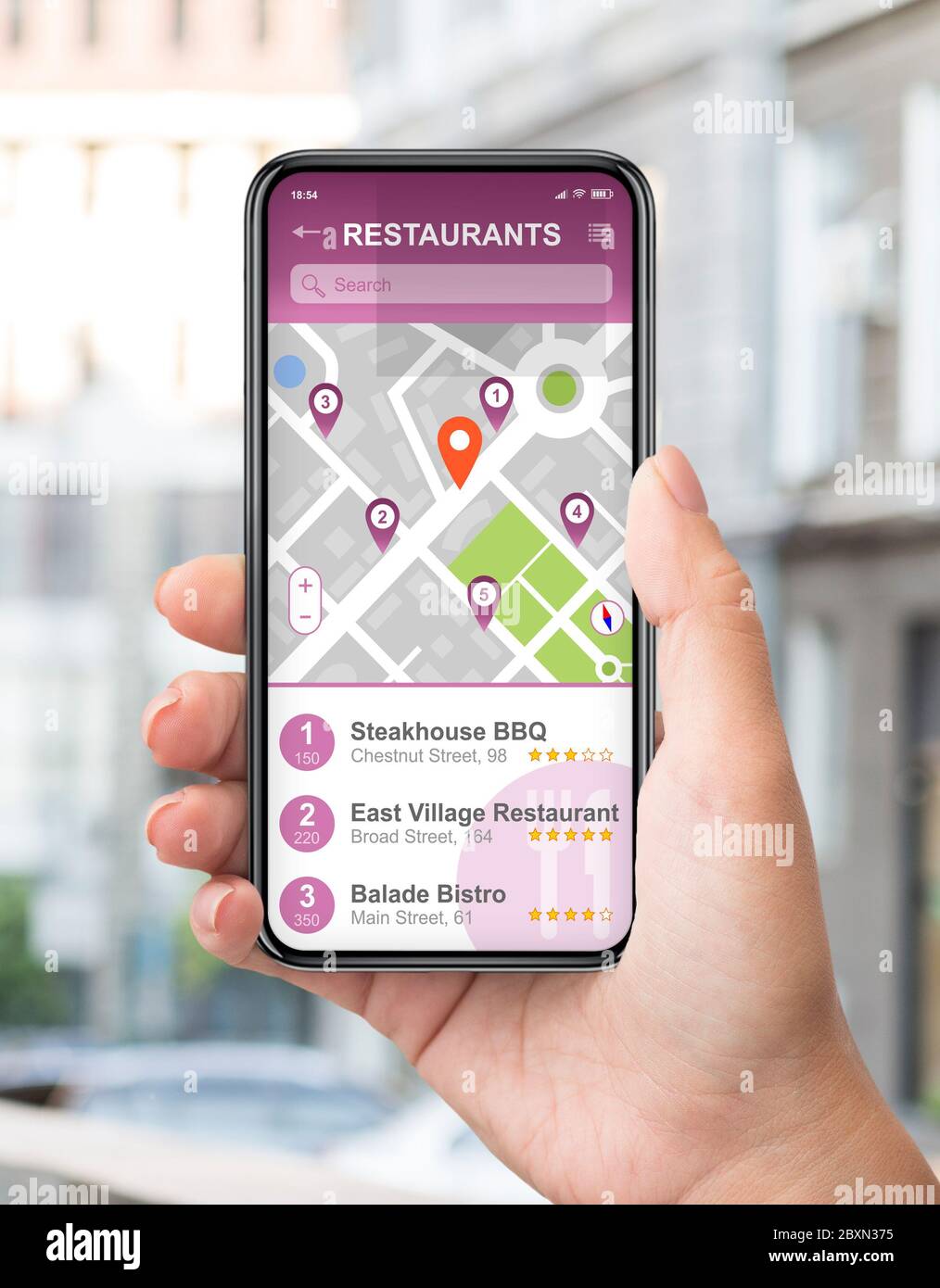 Female traveller using GPS navigation app to find good restaurants on