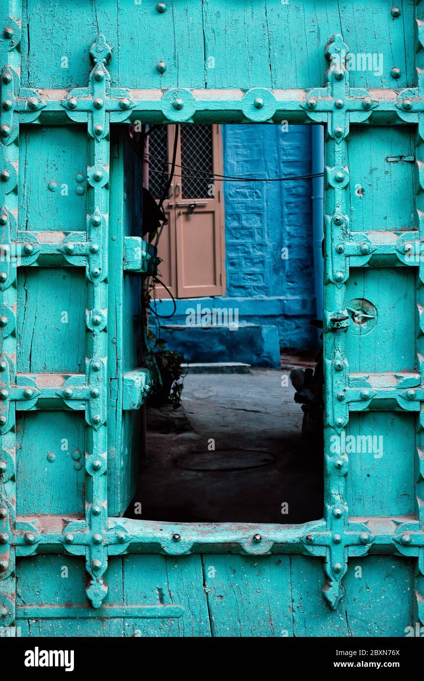 Old door in blue houses of Jodhpur, Rajasthan, India Stock Photo
