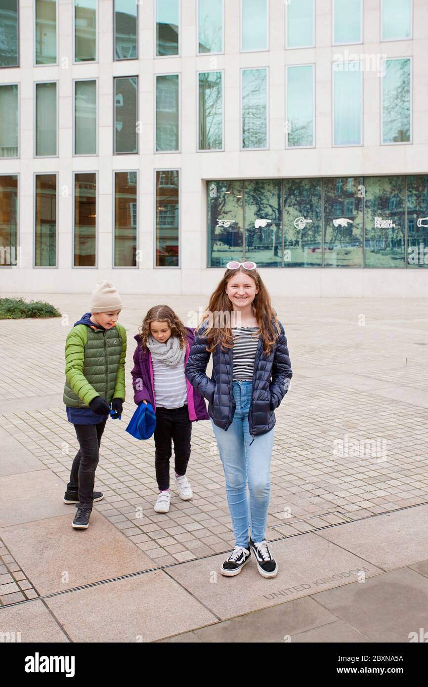 3 kids outside the Design Museum,Kensington High St, Kensington, London W8 6AG, United Kingdom Stock Photo