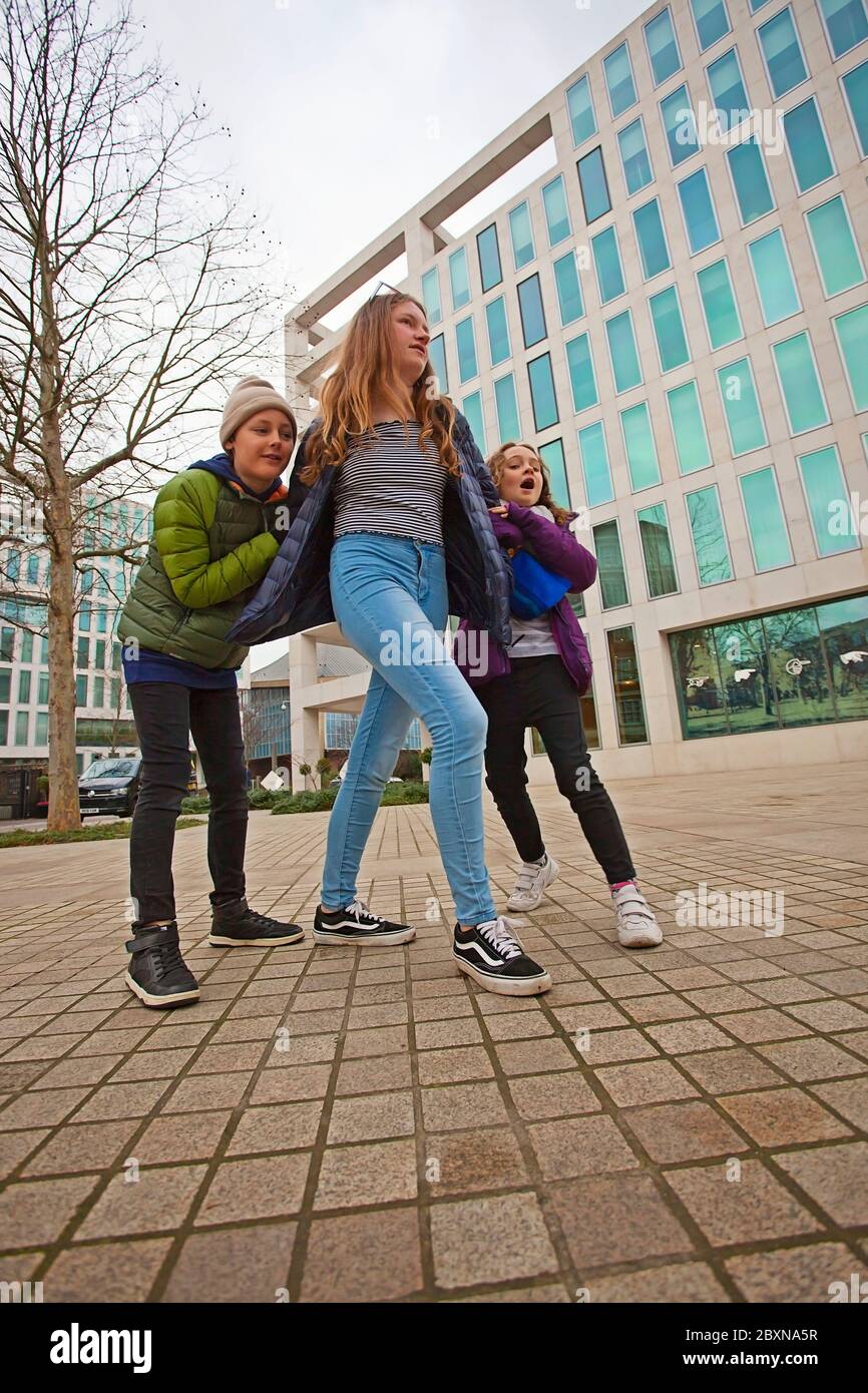 3 kids outside the Design Museum,Kensington High St, Kensington, London W8 6AG, United Kingdom Stock Photo