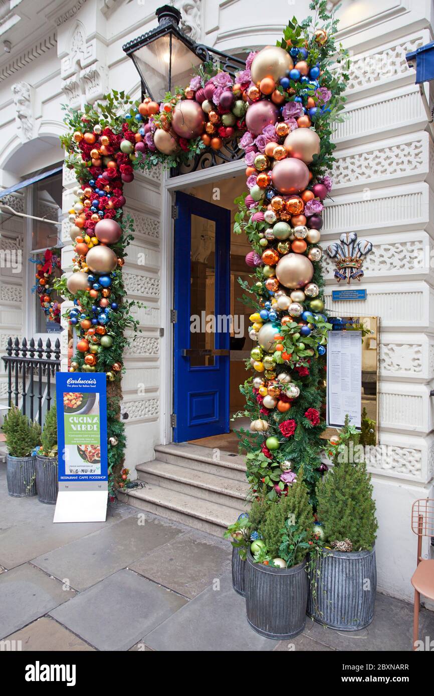 Holiday decorations embellish doorway Garrick St, London, United