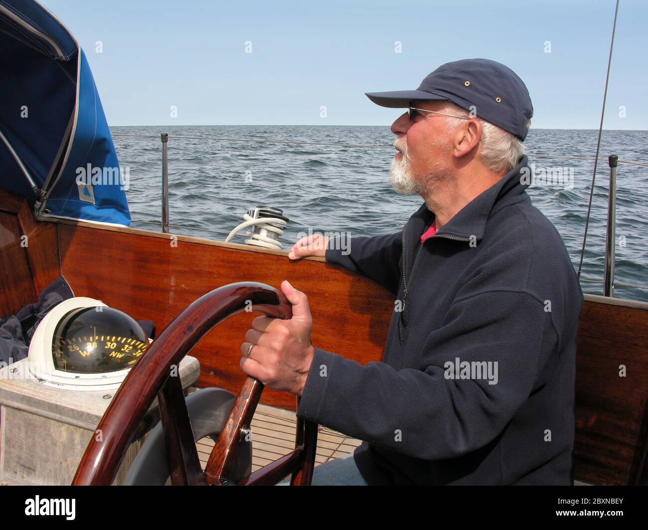 sailer at helm watch Stock Photo