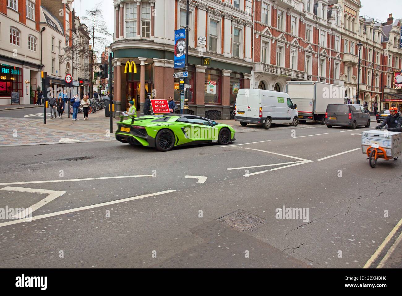 Green Lamborghini in front of a MacDonald's Restaurant, London Stock Photo