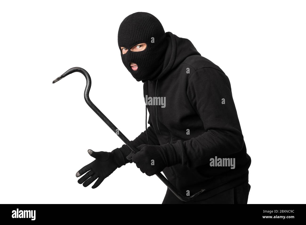Portrait of masked thief with crowbar isolated over white wall Stock Photo