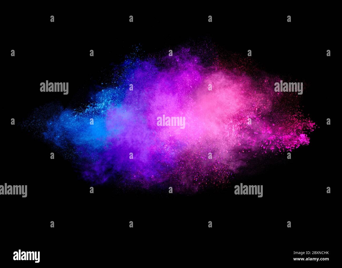 Colorful dust particle explosion resembling a pyrotechnic effect. Closeup of a color explosion