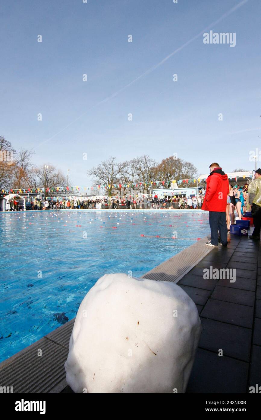 South London Swimming Club hosts the 5th Cold Water Swimming Championships at Tooting Bec Lido in South London, Britain's largest open-air, unheated fresh water pool. Over 600 swimmers braved the icy waters some wearing fancy dress. 25/01/2013 Stock Photo