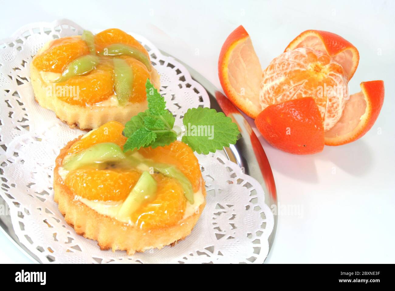 Mandarin cake with lemon balm Stock Photo - Alamy
