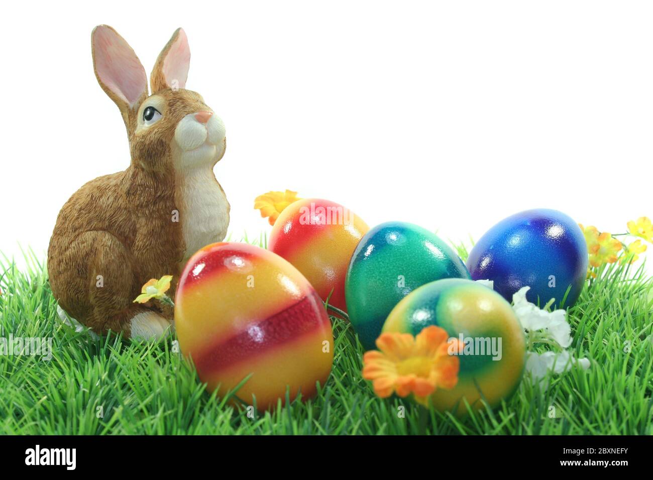 Easter bunny with eggs on a meadow Stock Photo
