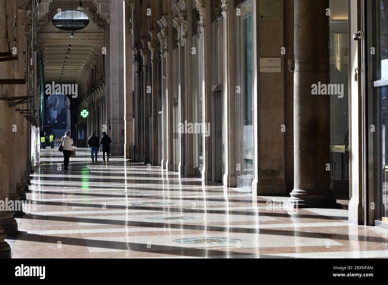 Empty Duomo square's colonnade due to the Coronavirus lockdown, with the Duomo cathedral, in Milan. Stock Photo