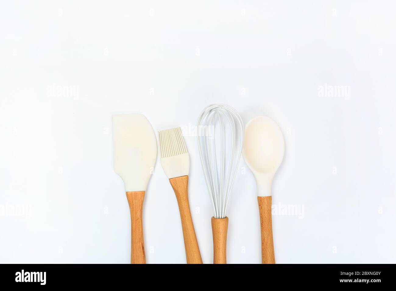 Set of kitchen utensils with wooden handles isolated on white ...