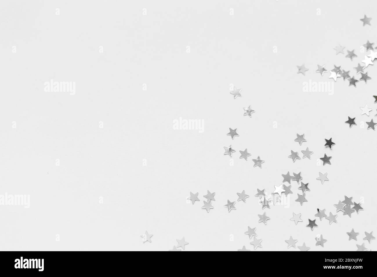 Silver sweets in the form of stars, glitter isolated on white background merry christmas party decoration, valentines day, mother's day and background Stock Photo