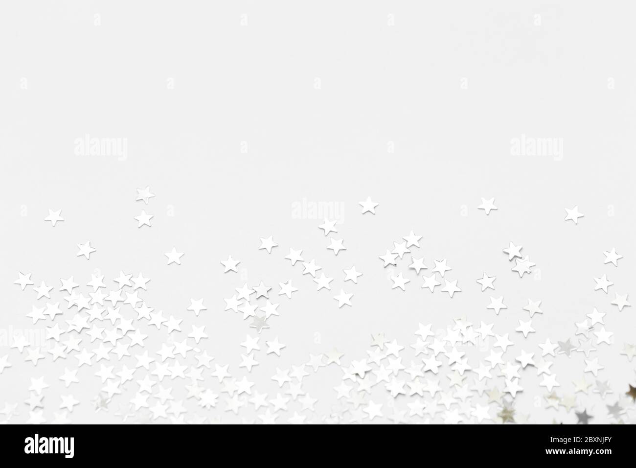 Silver sweets in the form of stars, glitter isolated on white background merry christmas party decoration, valentines day, mother's day and background Stock Photo